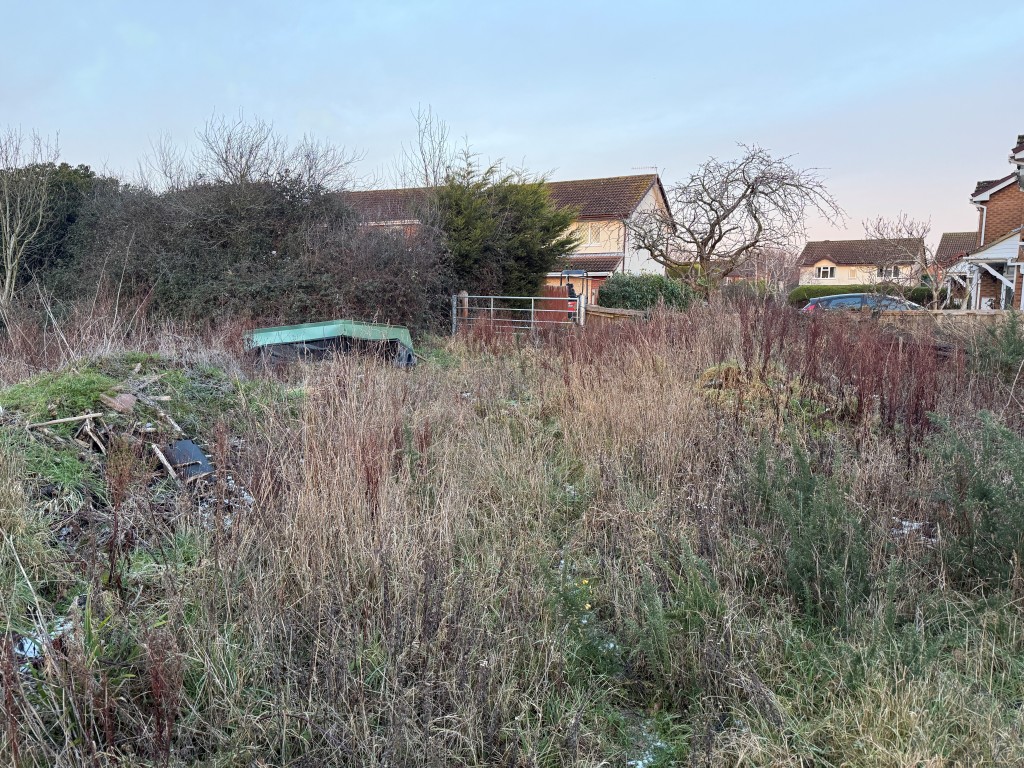 Lot: 50 - 1.6 ACRES OF LAND WITH POTENTIAL - View of land from south showing gated access